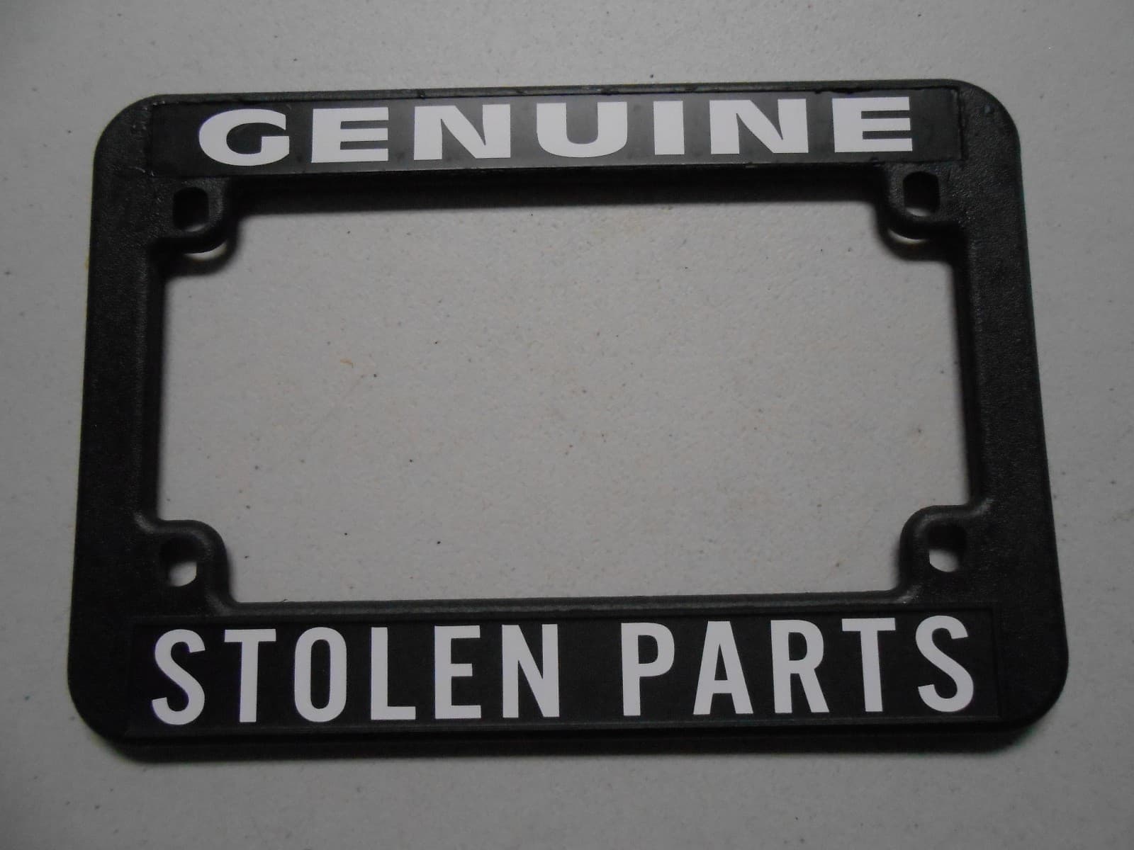MOTORCYCLE LICENSE PLATE FRAME "GENUINE STOLEN PARTS" CHOPPER HARLEY BOBBER