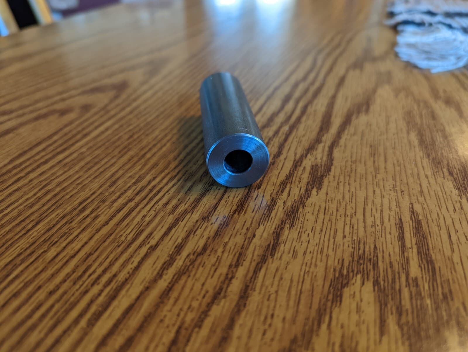 4 STEEL BUSHINGS, 2" LONG, 1.1275 OD, .6255 ID 4