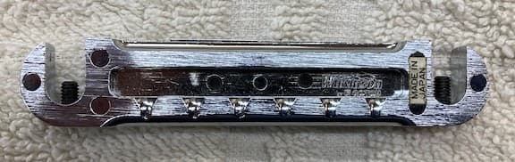 Wilkinson wrap around bridge  with adj saddles. Chrome no studs  MIJ  .used 2