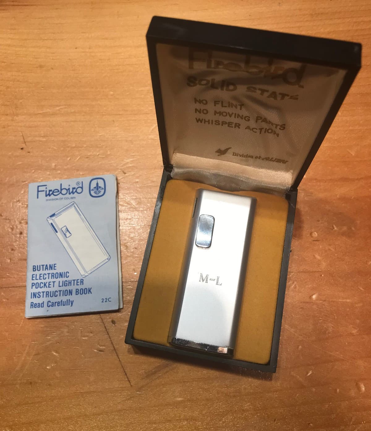 VINTAGE SLIM COLIBRI FIREBIRD LIGHTER WITH CASE & HAS INITIALS M-L ON THE FRONT