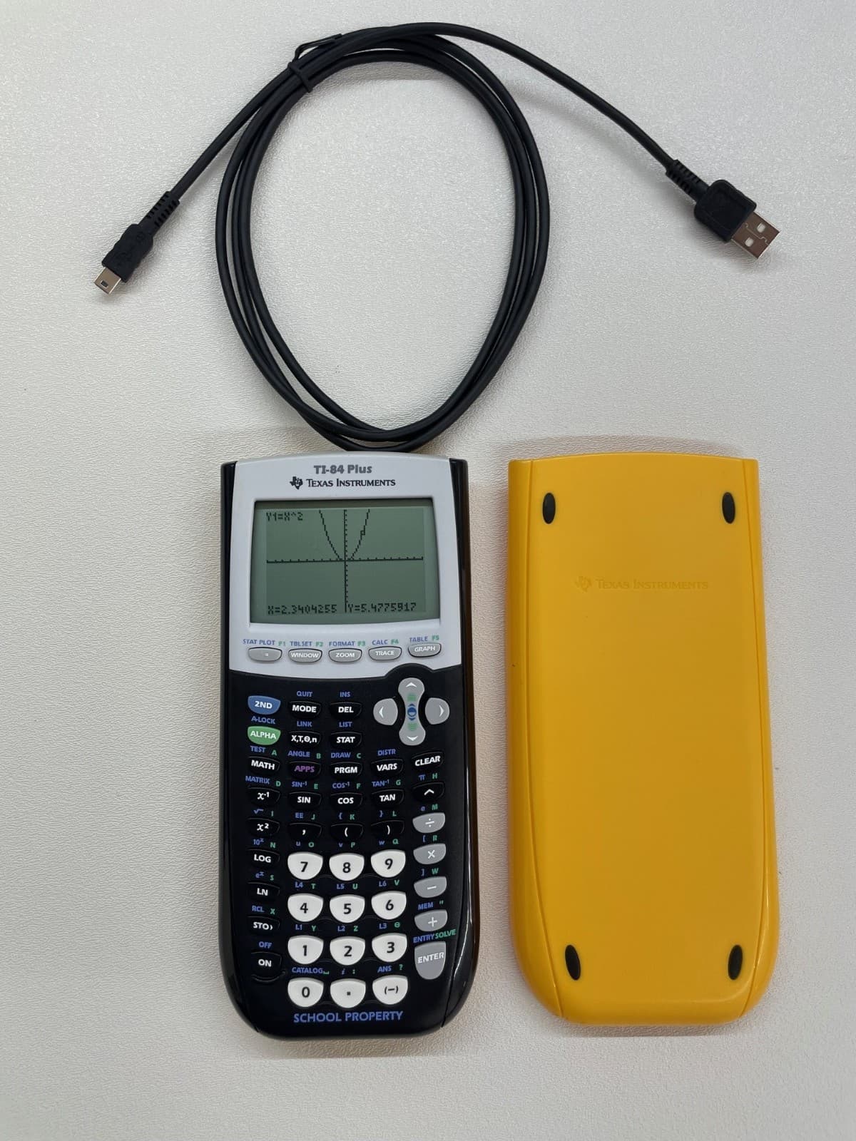 Texas Instruments TI-84Plus Graphing Calculator with School Property markings. 2