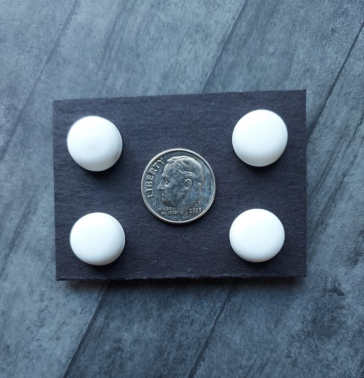 White magnetic pins.  Bib magnets, horse show number magnetic pins, clothing pin 3