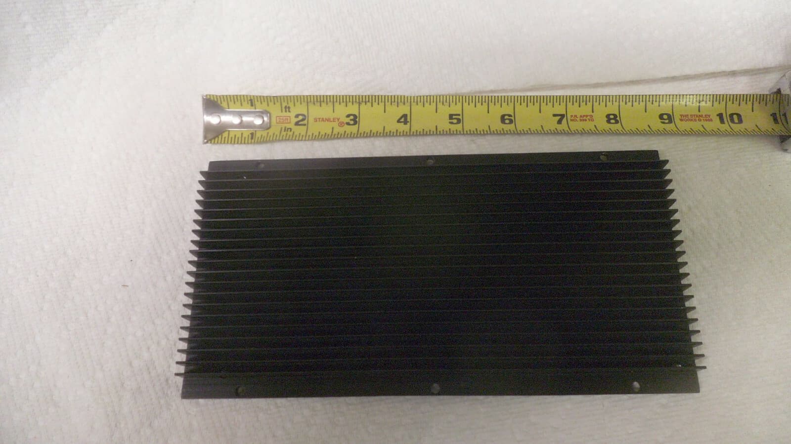 Black anodized Aluminum heat sink 8-1/2" x 4-1/4" x point 550" thick used