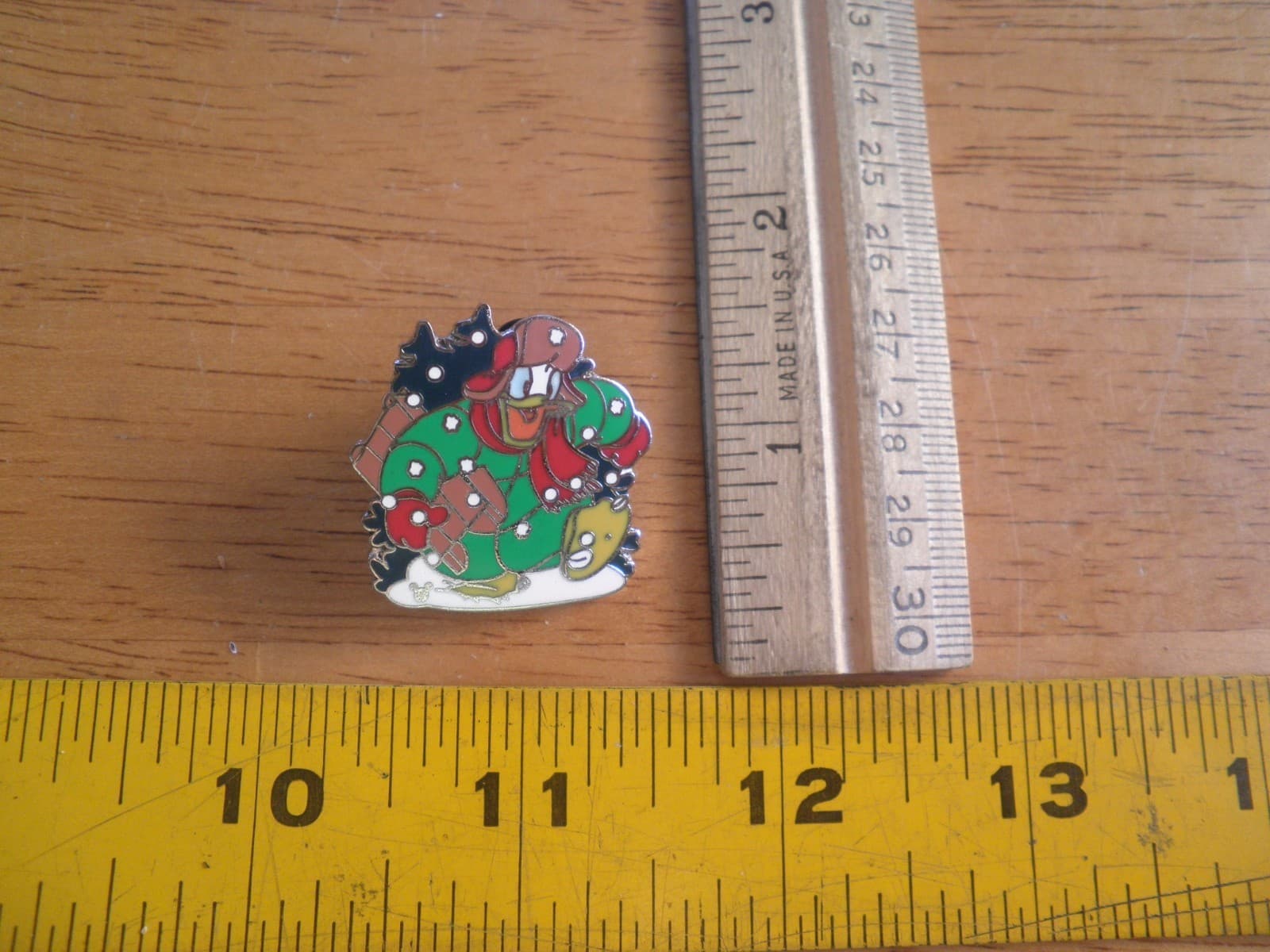 Donald Duck carrying Christmas gifts through snow green jacket Disney Pin