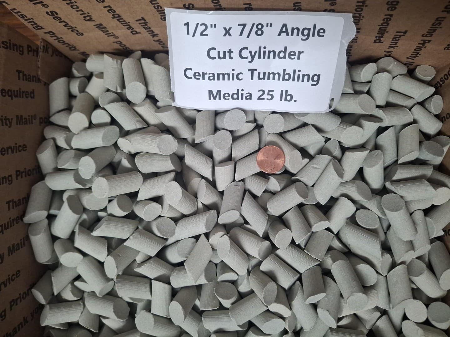 1/2" x 7/8" Angle Cut Cylinder Abrasive Ceramic Tumbling Media - 25 lb. 2