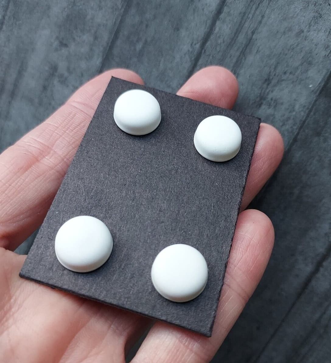 White magnetic pins.  Bib magnets, horse show number magnetic pins, clothing pin 4