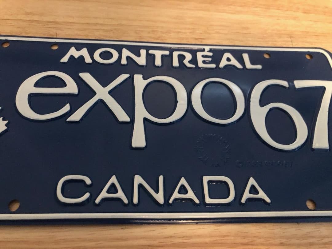 “MONTRÉAL EXPO 67” Blue Metal License Plate World’s Fair Canada 1967 Unused READ 2
