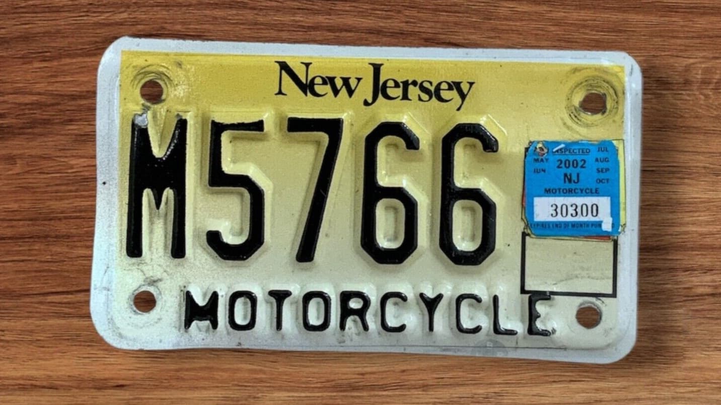 2002 NEW JERSEY MOTORCYCLE CYCLE LICENSE PLATE " M 5766 " NJ GOLDFINCH REFLECT
