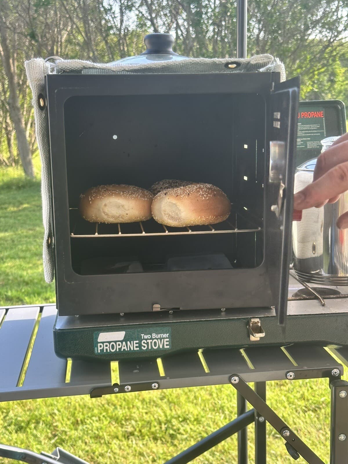 Coleman Classic Camp Oven Thermal Blanket plus an Interior Heat Diffuser plate. 3