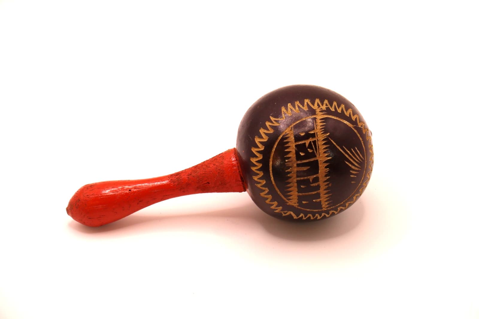 VTG Maraca with flower design and Aruba carved and painted. Handle is red.  2