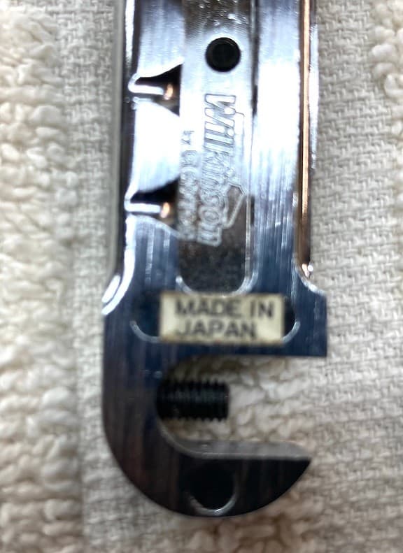 Wilkinson wrap around bridge  with adj saddles. Chrome no studs  MIJ  .used 3