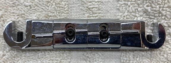 Wilkinson wrap around bridge  with adj saddles. Chrome no studs  MIJ  .used