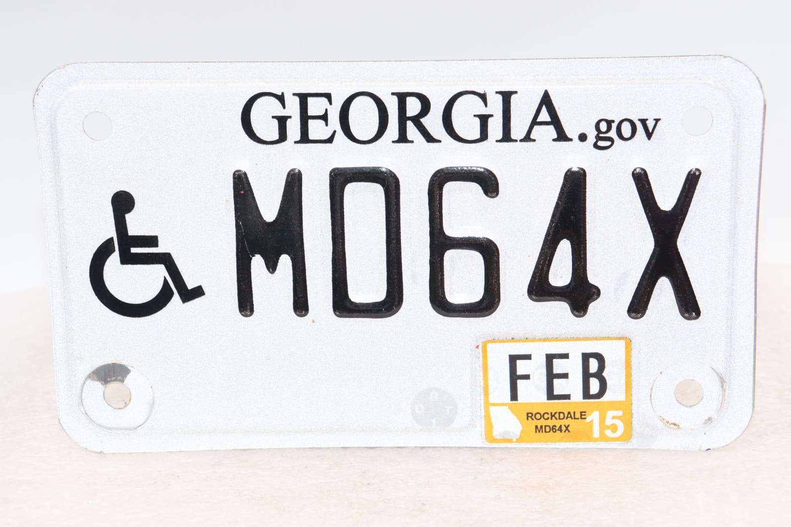 Expired, Georgia Handicap Motorcycle Plate, Registered in Feb. 2015 " MD64X "