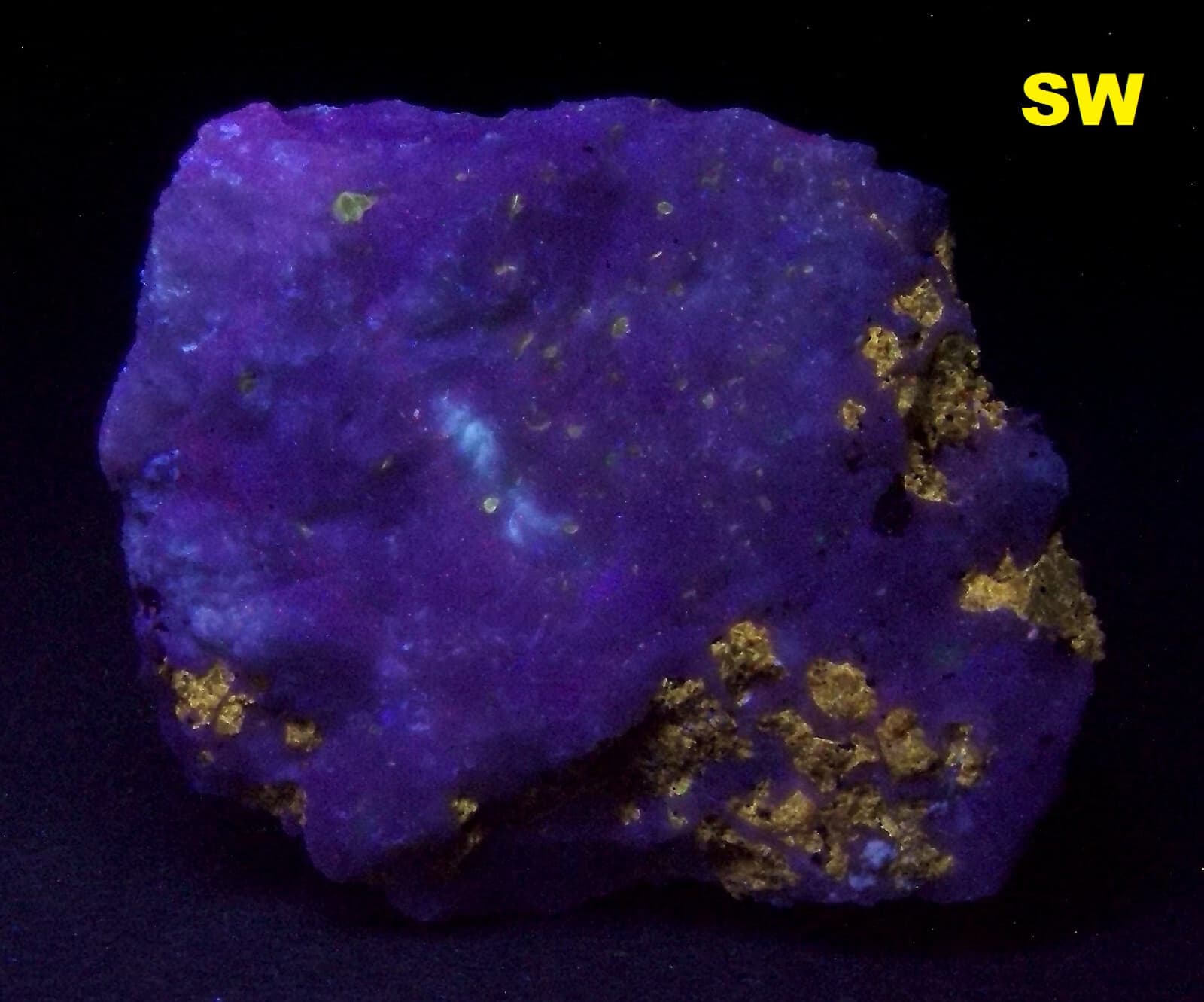 Fluorescent Dravite - Martin Marietta Texas Quarry, Baltimore Co., Maryland
