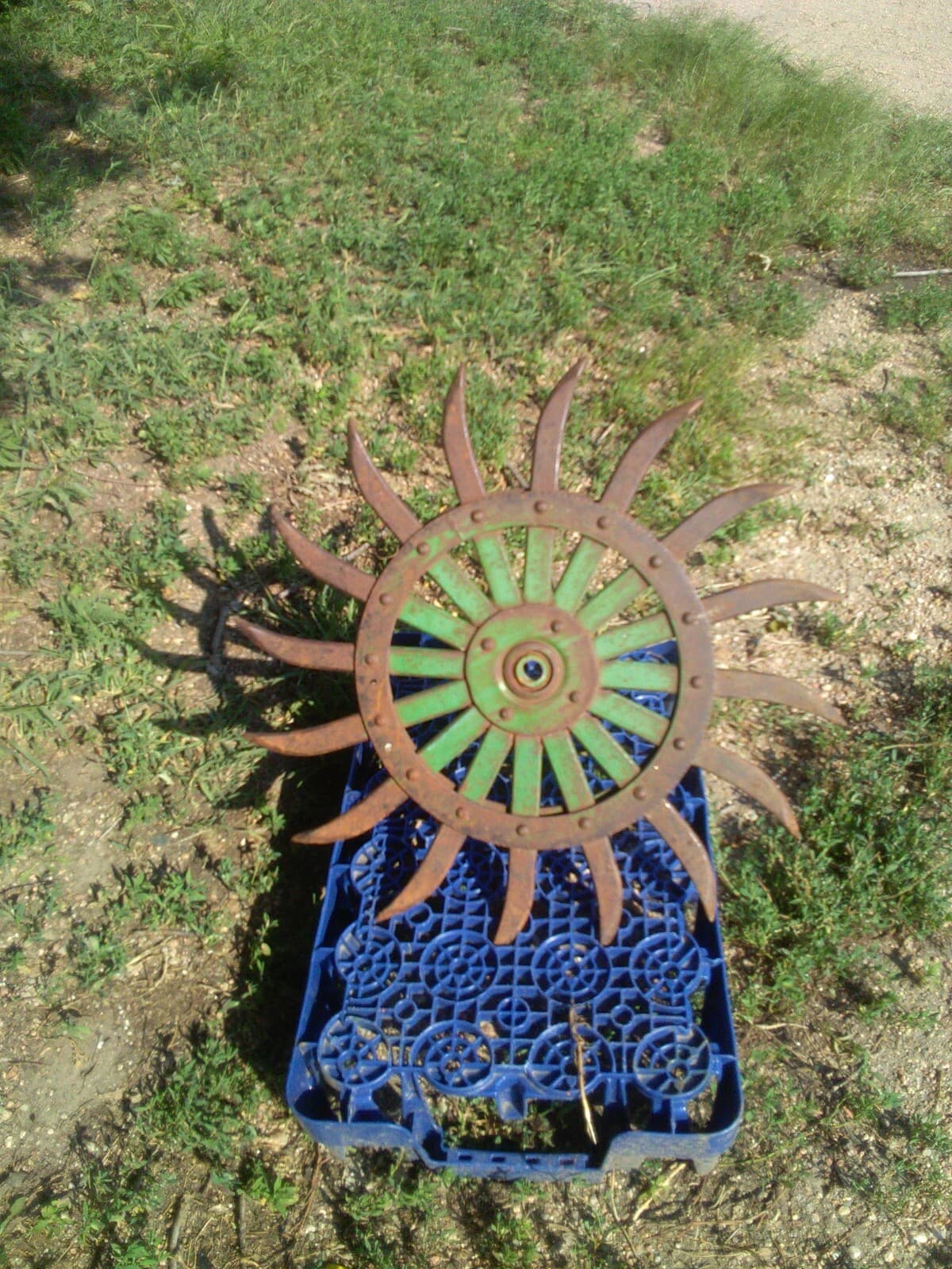 1 Wheel off of a John Deere Rotary Hoe, Yard Art Steampunk iron wheel