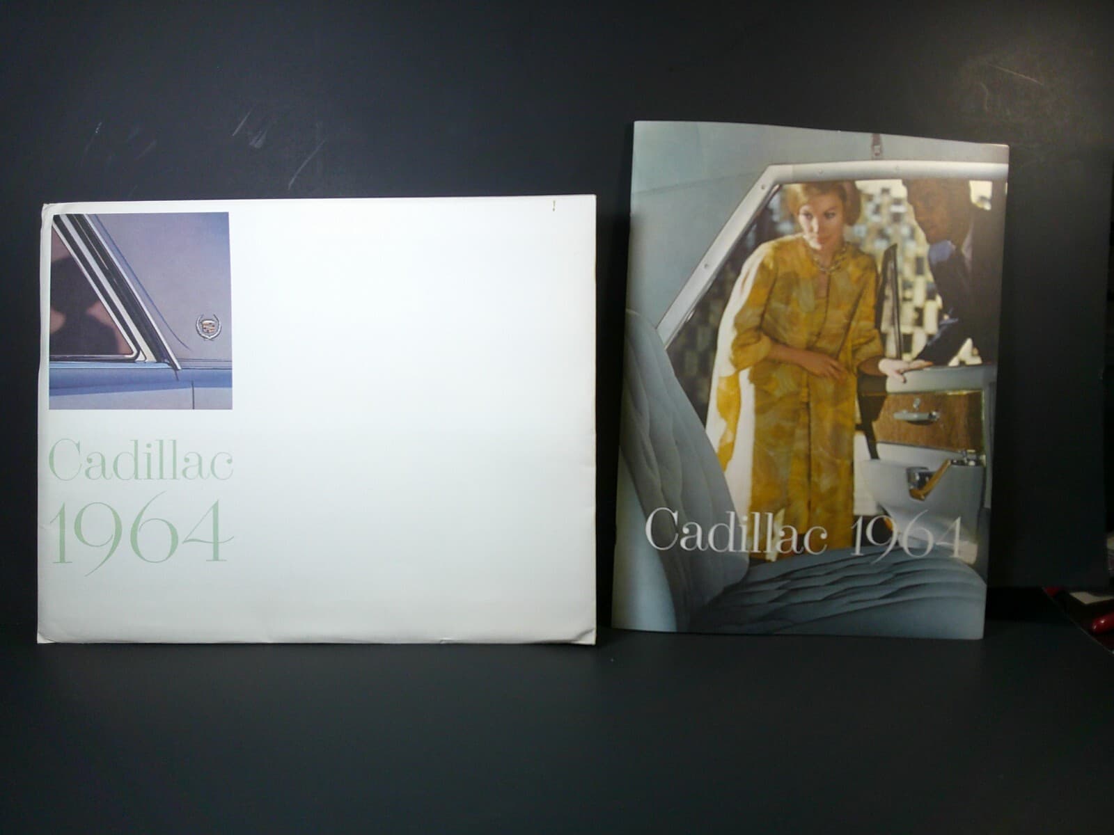 1964 CADILLAC SALES BROCHURE 9 1/2 BY 12 1/2 LARGE ORIGINAL WITH ENVELOPE NICE