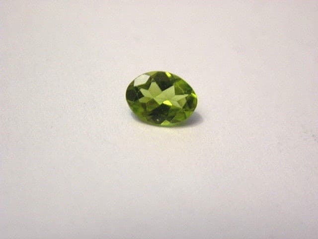 Peridot gemstone all natural India faceted 8x6mm oval