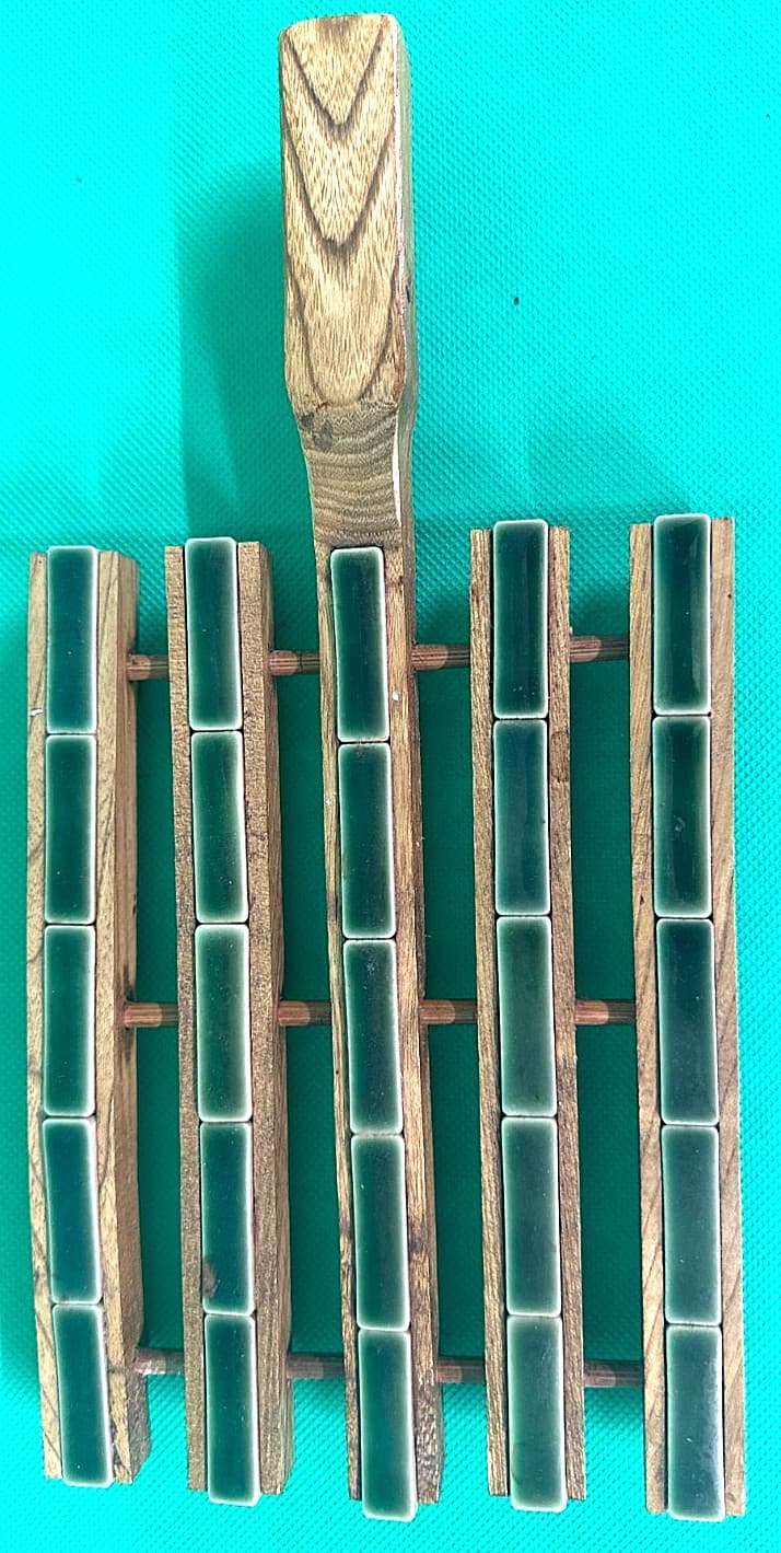 Teak and Ceramic Trivet with Handle. Base 8" X 6". Handle 4"